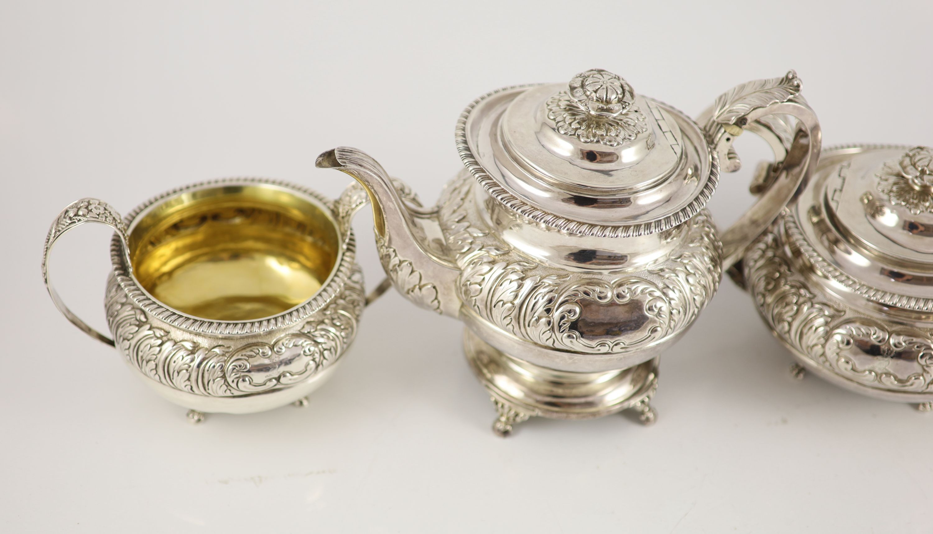 A George IV provincial silver three piece tea set by Barber & Whitwell, York, 1821 and a similar silver coffee pot, by Richard Pearce?, London, 1820